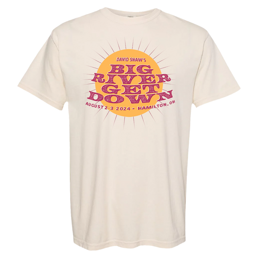 Cream-colored t-shirt with colorful retro-style ’Big River Lay Down’ event graphic on the front.