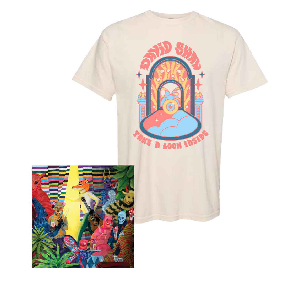 Cream-colored t-shirt with colorful psychedelic design featuring ’Good Soup’ text and a stylized bowl.